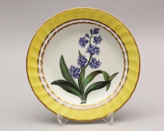 Pair of dessert Plates with fluted rims and named botanicals