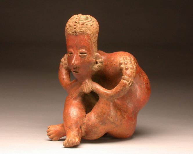 Figure of a seated person with spinal curature