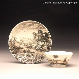 Teabowl and saucer painted with harbour scene