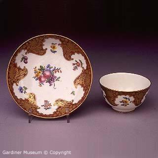 Teabowl and saucer with 'Claret' ground