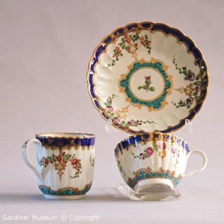 Trio (teacup, coffee cup and saucer) with flowring branches