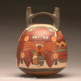 Double spout and bridge bottle with anthropomorphic mythical being or warrior