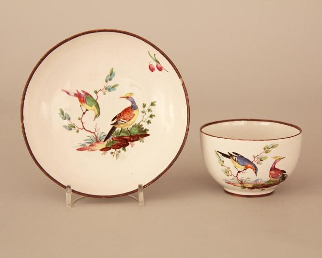 Teabowl and saucer decorated with exotic birts as derived from Sèvres