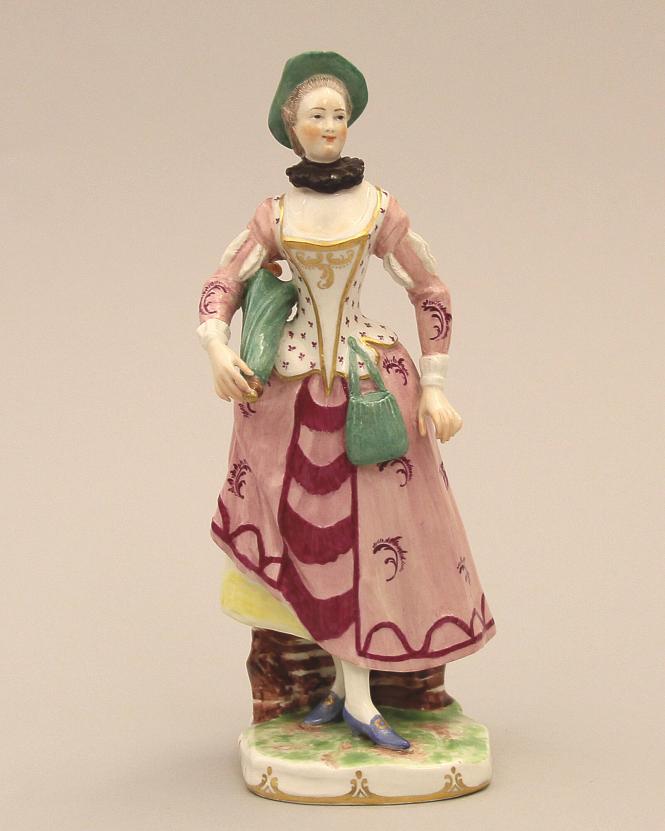 Figure of a woman holding an umbrella